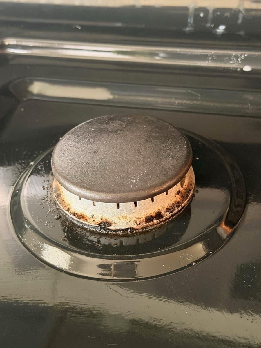 Before stovetop burner cleaning by The Fresh Finish