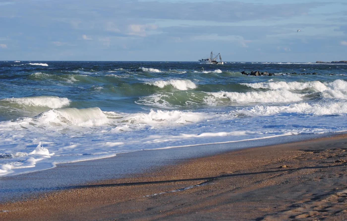 Atlantic waves rolling onto the sandy shoreline at Vilano Beach
